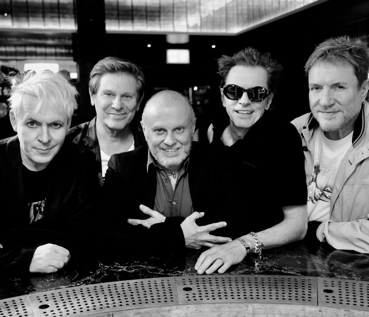 Photo of Duran Duran four members and Sergio Momo